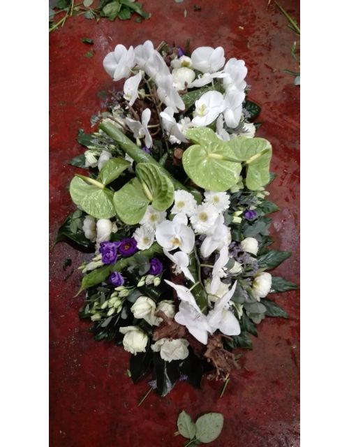 Rouwarrangement met orchideën